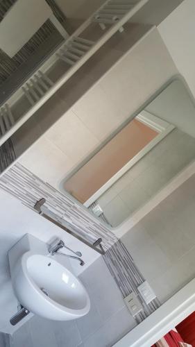 a bathroom with a sink and a mirror at La locanda di Gioele in Lido di Camaiore