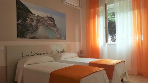 En eller flere senge i et værelse på La locanda di Gioele