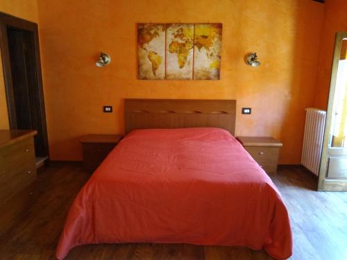 Un pat sau paturi într-o cameră la B&B Il Caùto