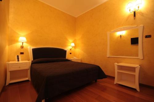 Cama o camas de una habitación en Hotel Rojan
