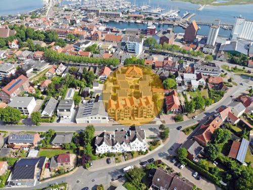 an aerial view of a city with a large building at Ostsee Perle 35 in Heiligenhafen