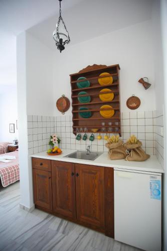 a kitchen with a sink and a counter at Ostria in Naousa