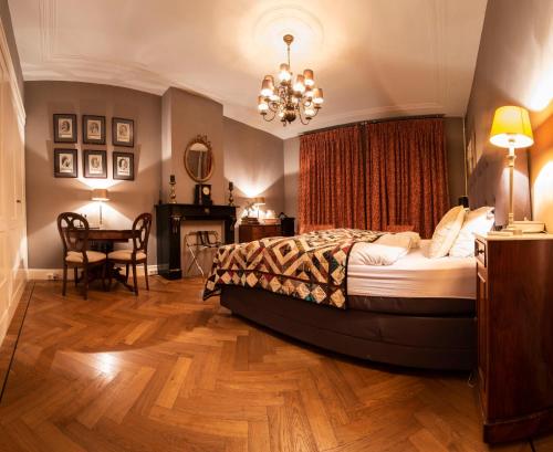 Säng eller sängar i ett rum på B&B De Schiedamse Suites