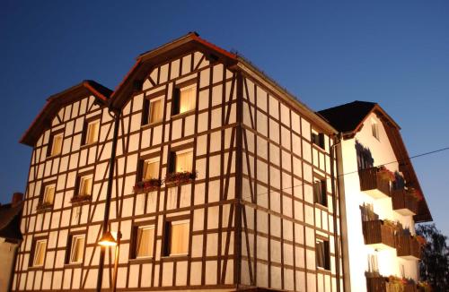 a white building with windows on the side of it at Adler Golf-& Tagungshotel in Harth - Pöllnitz