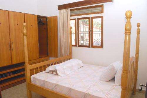 Кровать или кровати в номере Corinya Serviced Apartments