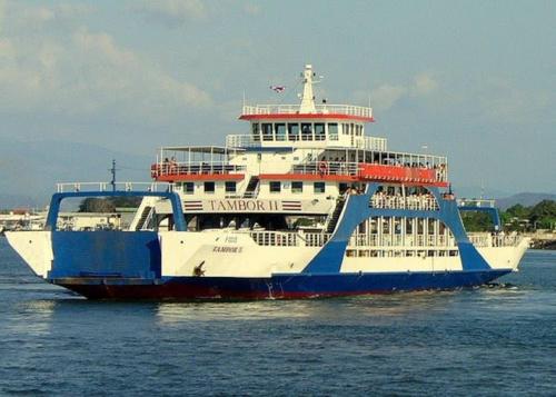 a large ferry boat in the water at Mapi's House in Paquera