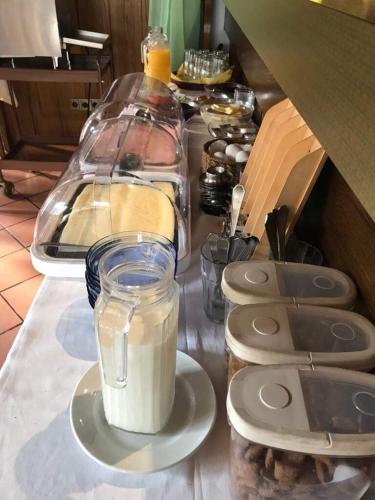 a counter top with a jar of milk on a plate at Neckarperle in Edingen-Neckarhausen