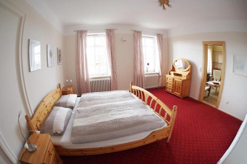 Un pat sau paturi într-o cameră la Ferienhof Gintoft