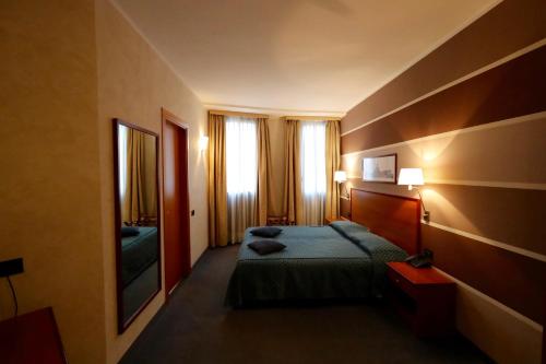 Postel nebo postele na pokoji v ubytování Classic Hotel Tulipano