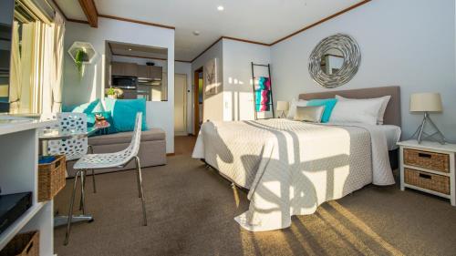 A bed or beds in a room at Romantic Piha