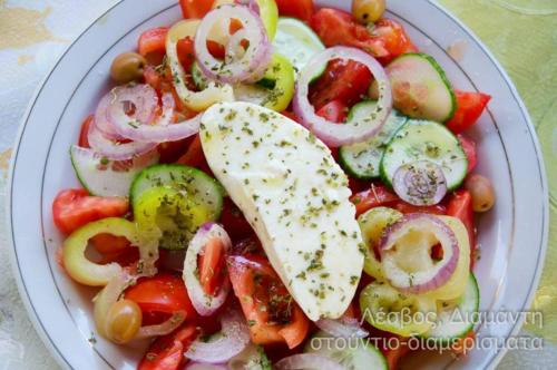 a plate of food with vegetables on a table at Diamanti Molivos Studios & Apartments in Mithymna