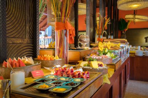 a buffet line with many different types of food at Golden Temple Hotel in Siem Reap