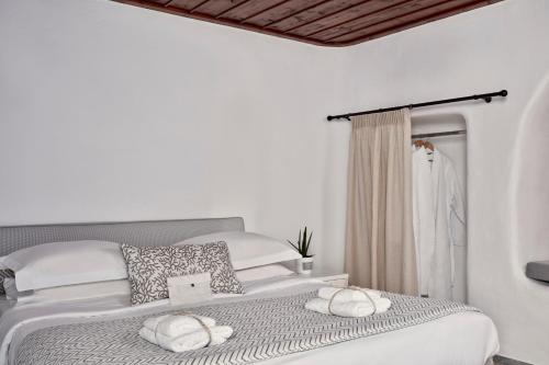 Ένα ή περισσότερα κρεβάτια σε δωμάτιο στο Mykonos Princess Hotel