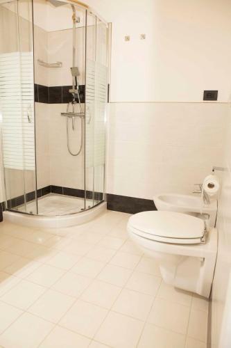 a bathroom with a toilet and a shower at BENinCASA in Lecce
