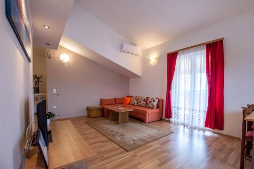 a living room with a couch and a table at Apartment Lavanda 2 in Poreč