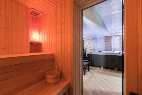 a room with a sauna with a tub in the background at Rezydencja Zakopiańska in Zakopane