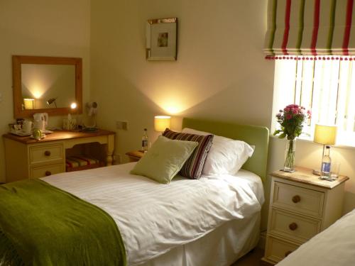 Ένα ή περισσότερα κρεβάτια σε δωμάτιο στο Ashberry Guest House