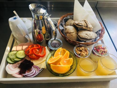 a tray filled with different types of food and drinks at Villa Vendel B&B in Løkken