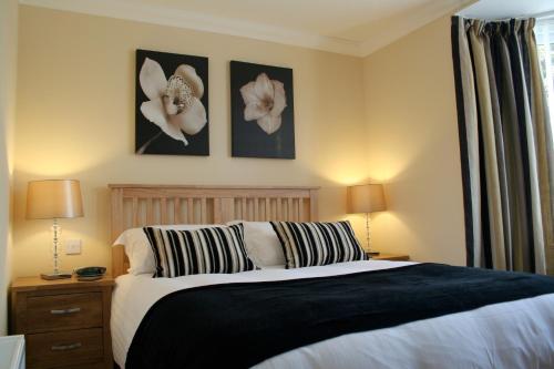 Ένα ή περισσότερα κρεβάτια σε δωμάτιο στο Ashberry Guest House