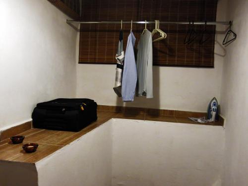 a bathroom with a large bath tub with a bag at "PefkoPetro" Traditional House in Keramotí