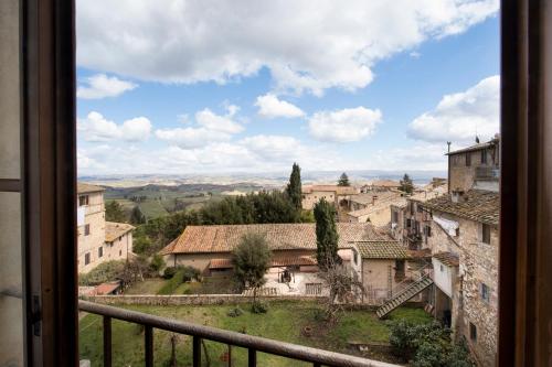 a view from a window of a village at Leon Bianco in San Gimignano