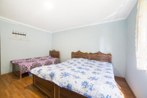 Ein Bett oder Betten in einem Zimmer der Unterkunft Guest Houze Nona