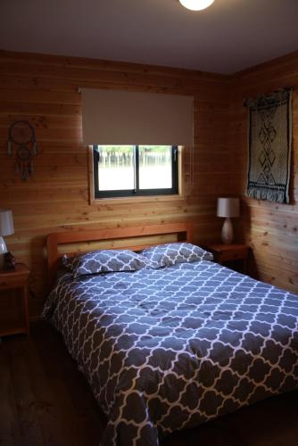 Cama ou camas em um quarto em Cabaña Aroma de Campo