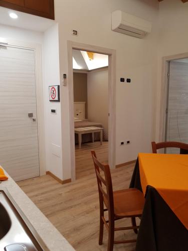 a kitchen and dining room with a table and chairs at San Pietro in Mileto
