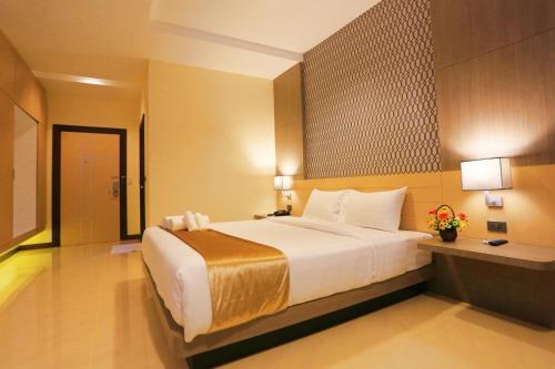 Postel nebo postele na pokoji v ubytování iBiz Boutique Hotel