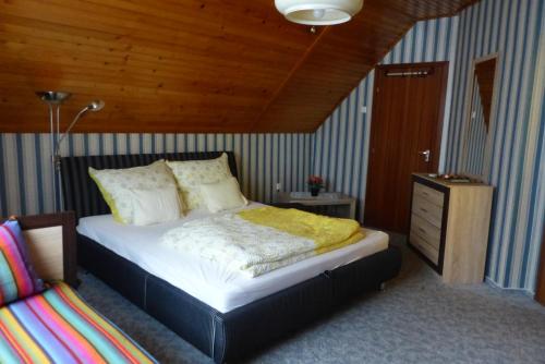 Postel nebo postele na pokoji v ubytování Orwa Vendégház