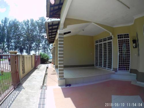 an outside view of a house with a porch at FBS Guesthouse Dungun in Dungun