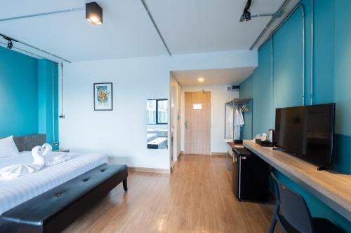 Postel nebo postele na pokoji v ubytování S.22 Hotel Suratthani