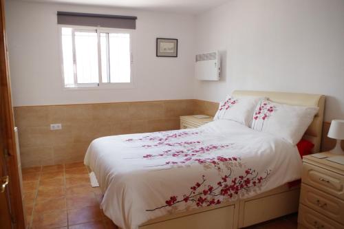 Posteľ alebo postele v izbe v ubytovaní Casa Leonora