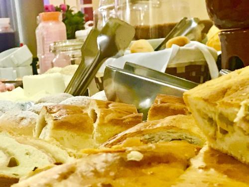 a bunch of bread sitting on a table at Hotel Platanus in Campos do Jordão