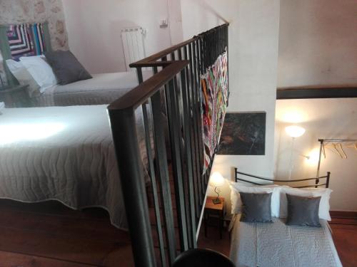 Ένα ή περισσότερα κρεβάτια σε δωμάτιο στο Residenza Storica le Civette