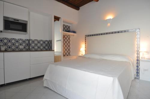 A bed or beds in a room at Stella Marina Amalfi Dreams
