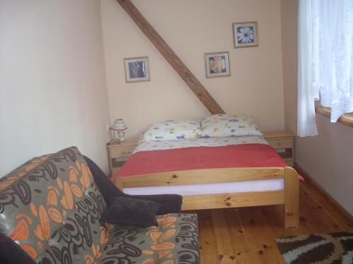 Postel nebo postele na pokoji v ubytování Apartamenty wakacyjne nad jeziorem Juksty