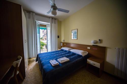 Postel nebo postele na pokoji v ubytování La Caravella