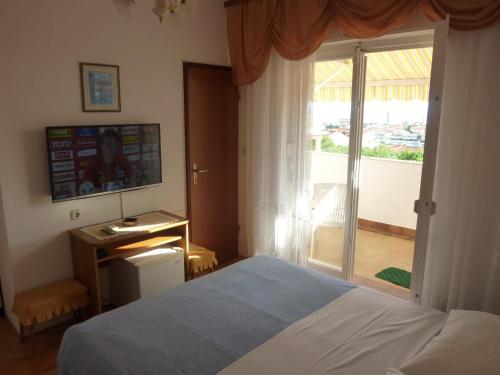 Postel nebo postele na pokoji v ubytování Guest House Mireja