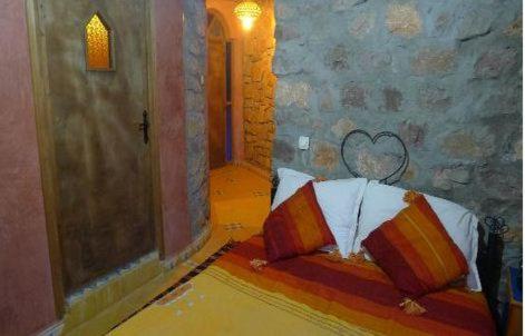 a room with a bed with two pillows on it at Auberge Le Festival Todra Gorge in Aït Baha