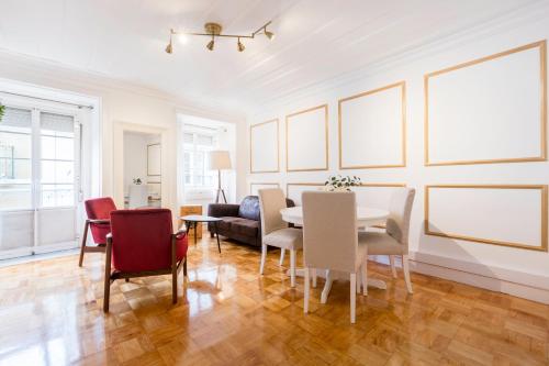 a living room with a table and chairs at Your Place in Lisbon in Lisbon