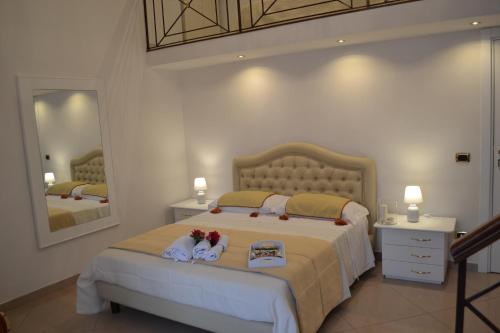 Tempat tidur dalam kamar di Dimora Real Maria