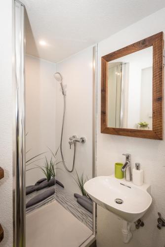 a bathroom with a sink and a shower at Urlaub auf der Alm "Deluxe" in Preggraben