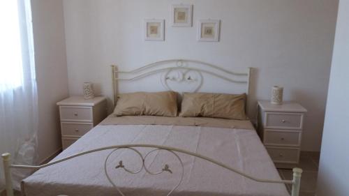 A bed or beds in a room at Il Fico d'India dell'Antico orto
