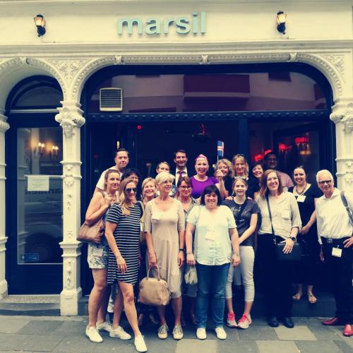 a group of people posing for a picture in front of a store at MAISON MARSIL - Boutique Hotel Köln in Cologne
