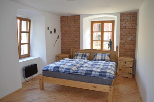 מיטה או מיטות בחדר ב-Wintermill