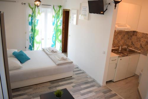 Postel nebo postele na pokoji v ubytování Apartments Milas