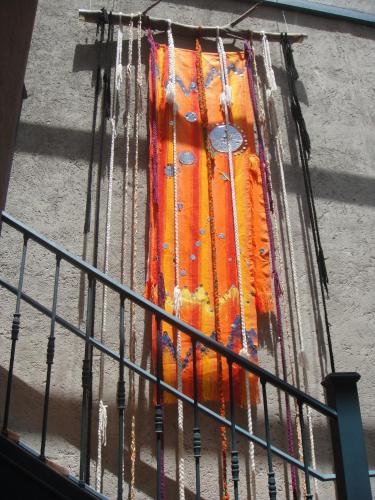 an orange fire hydrant is covered in water at Kkala Boutique Hotel in Salta