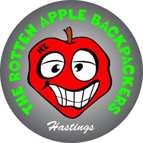 an apple bakery logo with a smiling red apple at The Rotten Apple Backpackers in Hastings