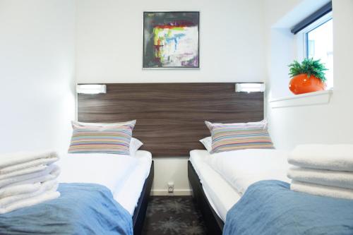 En eller flere senge i et værelse på ApartHotel Faber